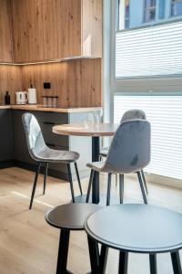 K&M Apartments Tauron Arena, Lema