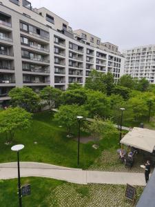 Cozy Urban Residence Studio - balcony with garden view