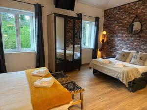 Appartements LES LOGES DE BACCHUS Le petit Loft : photos des chambres