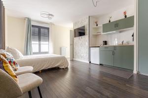 Appartements Studio Luxe - Vue Tour Eiffel - Proche Paris & Versailles : photos des chambres