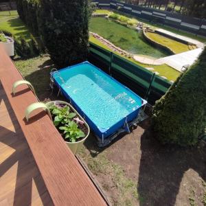 Bajkowe Chatki domki letniskowe nad jeziorem Narie