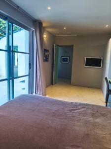 Villas ღ Villa des Astres 850 m2 - Piscine, Jacuzzi, Sauna, Hammam, & Salle de Cinema : photos des chambres