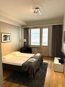 Kotimaailma Apartments Kamppi - 2BR in the city center with code lock