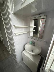 Bright bedroom with king side bed and share bathroom