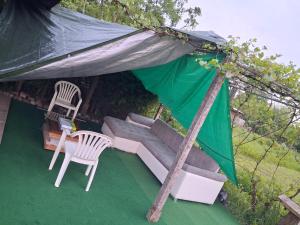 LAND FOR YOUR TENT NEXT TO A RIVER WITH A GARDEN SHACK ROOM you get two bicycles for amazing views and two water floats for a nice river run USE THE LOCATION NOT THE ADDRESS TO GET HERE bathroom is a bit different so check YouTube video RiverRunDusko