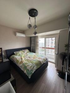 apartment tow bed room and living room with pool and gym