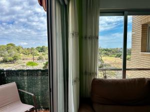 Peaceful Apartment with Sea & Nature Views, Terrace, Pool and Garage