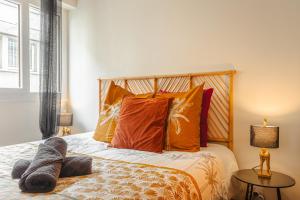 Appartements Jungle Saintaise - Coeur de ville, Calme, Tv 4K, Fibre, Netflix, Parking Surveille Qpark 150m : photos des chambres