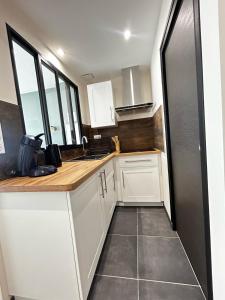 Appartements La Suite Porcelaine, calme et chic : photos des chambres