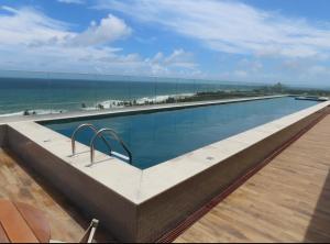 Apt quarto e sala moderno vista mar