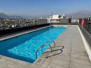 Ñuñoa apartment with AC, green decor, and parking