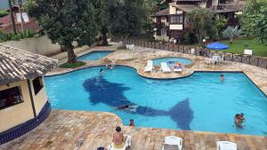 Casa de condomínio com piscina em frente a praia de Maresias