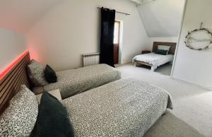 Maisons de vacances Maison - La campagne pres de la ville : photos des chambres