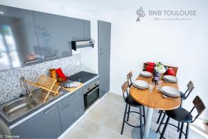 Appartements BNB TOULOUSE - Refuge urbain - Clim - Terrasse - Parking - WiFi - Proche transports : photos des chambres