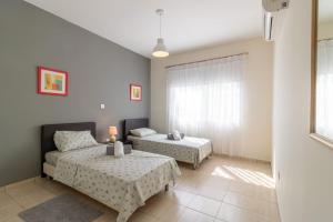 Villa Matheos - Elegant 3-BR Retreat near Coralia Beach