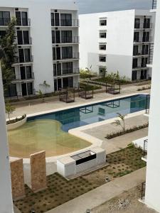 Bonito y Comodo Departamento con Alberca cerca de la Playa