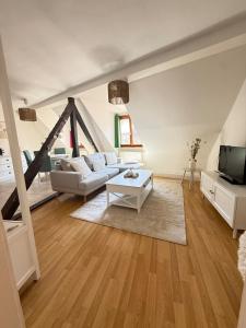 Appartements Charme et Confort, plein centre : photos des chambres