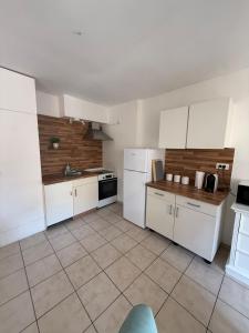 Appartements Charme et Confort, plein centre : photos des chambres