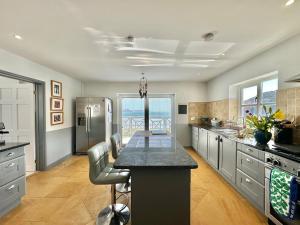 The Sandcastle. Private steps onto a sandy beach