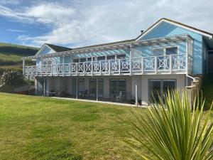 The Sandcastle. Private steps onto a sandy beach