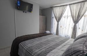 Habitación Privada en Kzona, Cerca al aeropuerto, Ideal para Escalas y Trámites