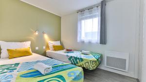 Chalets LE FAMYLISSE Sejour d-Exception Confort & Bien-Etre en Lodge familial - 10min des Sables d-Olonne : photos des chambres