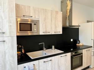 Appartements Le Riquet - Parking et jardin prive, clim, RDC : photos des chambres
