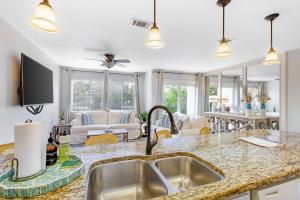Coastal-Chic Condo Steps from the Sand