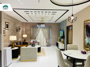 Ruby - Chic & Luxury WanderNest Suite at B3 Heights with Gym in Bahria Town Ph-8