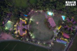 Nivaant Farms by StayVista - Green Retreat with Pool, Orchard, Jacuzzi & Gazebo
