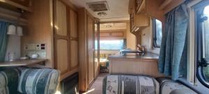 A very neat English caravan for 4 withamenities and view of the horses