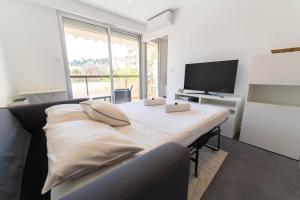 Appartements Magnifique Appartement, Piscine, Proche gare : photos des chambres