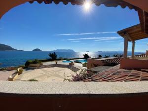 Luxury apartment Ginepro sea view with common swimming pool just 50 mt from the beach