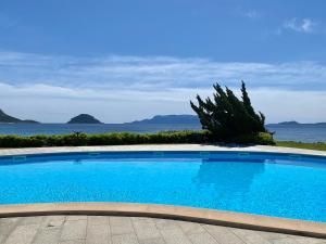 Luxury apartment Ginepro sea view with common swimming pool just 50 mt from the beach