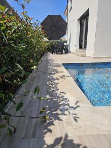 Maisons de vacances Villa neuve avec piscine : photos des chambres