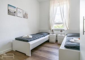Voll ausgestattete und möblierte Apartments mit Einzelbetten - Küche - WLAN - PKW-Parkplatz