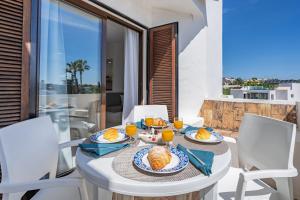 Sunny Flat with a Balcony & Pool by HostWise