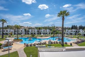 Sunny Flat with a Balcony & Pool by HostWise