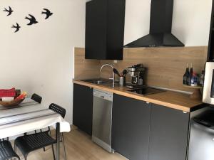 APPARTEMENT FACE À LA PLAGE Terrasse-Garage-Wifi-Draps et Serviettes