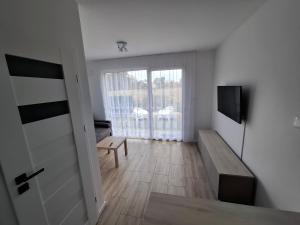 Apartament w Pszczewie nad jeziorem Duży Szarcz