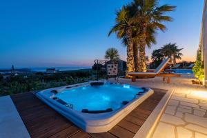 Luxury Stone Villa Smokvica in Rogoznica with Heated Pool, Jacuzzi, Vineyard and Sea View
