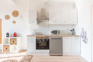 Appartements Appartement spacieux, chaleureux & tout confort : photos des chambres