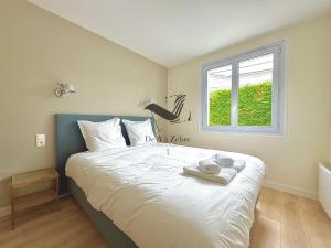 Maisons de vacances La Verrerie - Maison coeur de ville avec jardin : photos des chambres