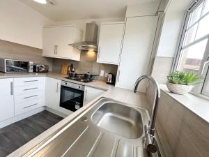 Turnstile Place by Blue Skies Stays