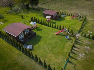 Atpūtas mājiņas Kolkā- Madaras un Rota