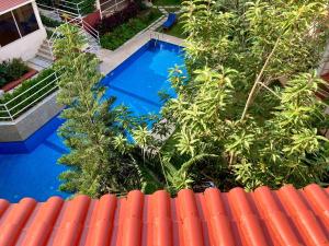 2 bedroom apartment with forest view, pool and gym in North Goa