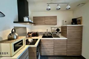 Maisons de vacances Le Jardinet - With office in the city center! : photos des chambres