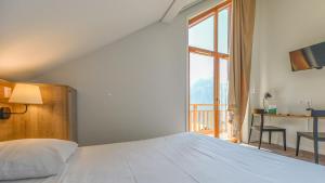 Hotels Villages Clubs du Soleil - OZ EN OISANS : Chambre Quadruple avec Balcon 