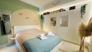 Appartements Charme & Soleil YourHostHelper : photos des chambres