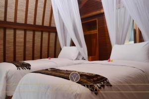 Bungalow Deluxe 2 Giường Đơn Nhìn ra Vườn (Deluxe Twin Bungalow with Garden View)